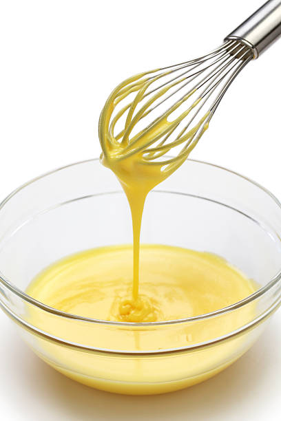 istock whisking egg yolks and sugar in a bowl 510247703
