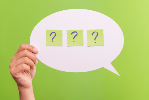 White text Bubble isolated on green background, with the question mark in the middle.