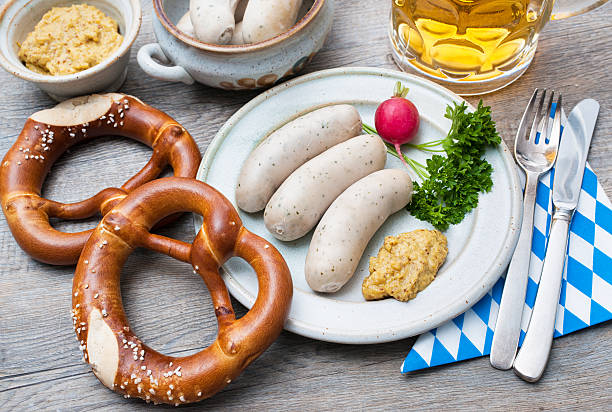 Bavarian meal Bavarian meal. White sausages with sweet mustard and pretzels weisswurst photos stock pictures, royalty-free photos & images