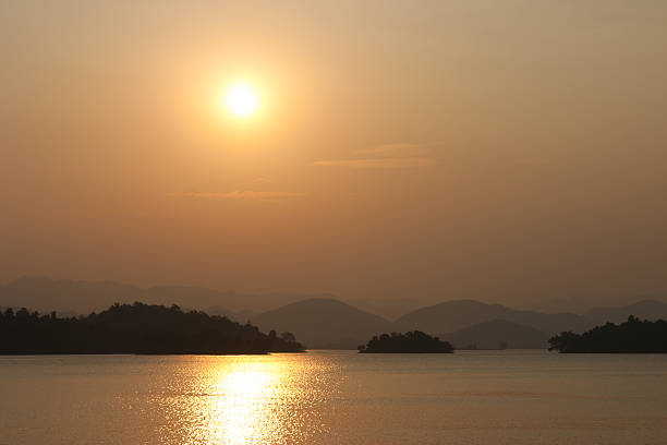 istock Sun set with river and mountain background 510268643