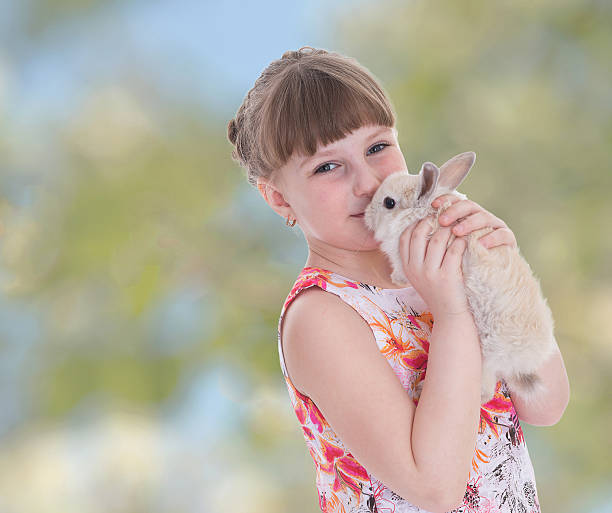 istock Charming girl kisses rabbit. 510269069