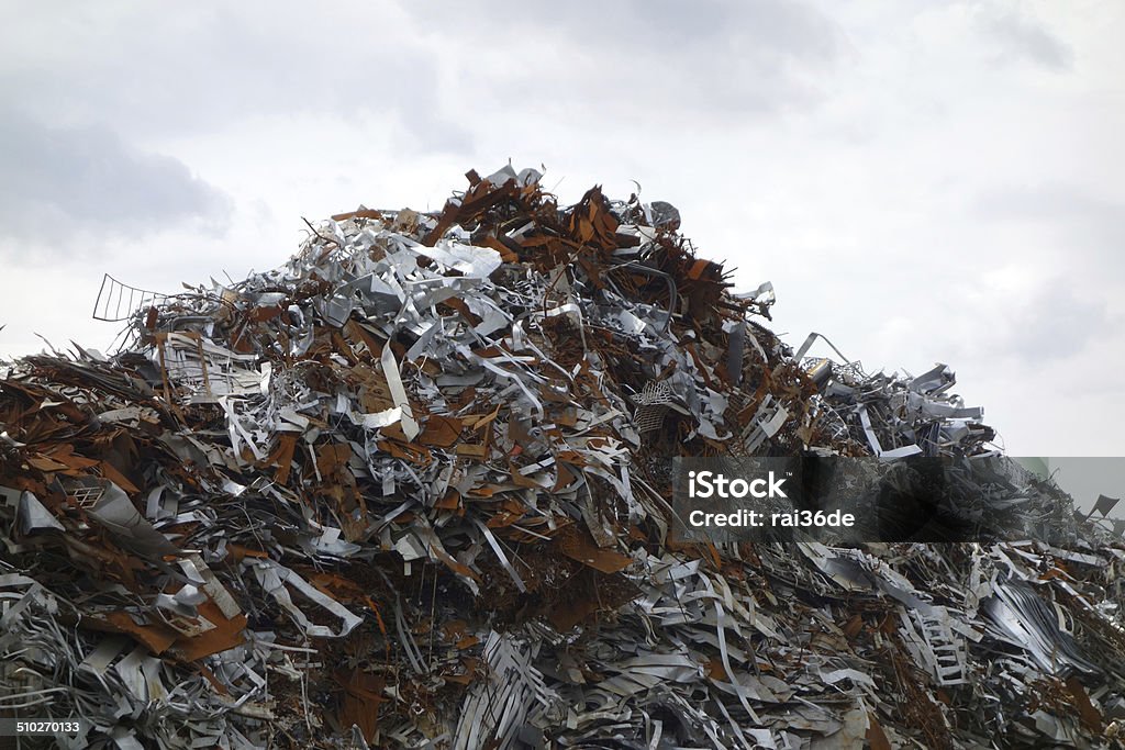 Silver gloss and rust A mountain of scrap metal silver-coloured and brown rust Chrome Stock Photo