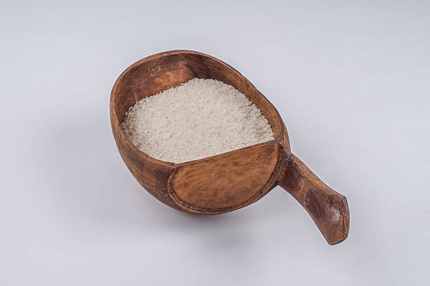 istock Wooden spoon with rice 510271095