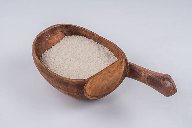 istock Wooden spoon with rice 510271099