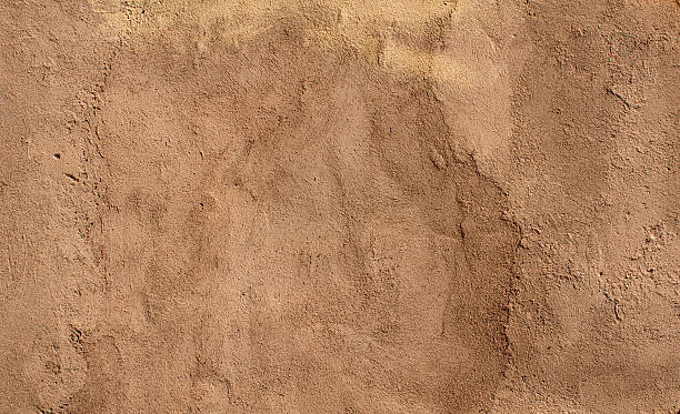 istock Texture of wall covered yellow stucco 510284775