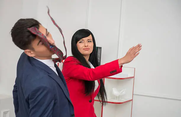Photo of Portrait of young business woman  giving a  slap in the