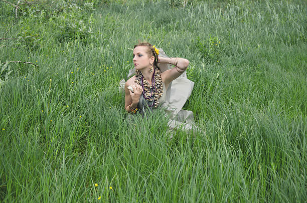Short portfolio-session in a forest with a young model in skirt.