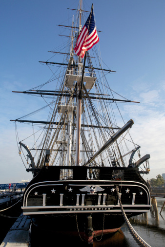 USS Constitution is a wooden-hulled, three-masted heavy frigate of the United States Navy. Named by President George Washington after the Constitution of the United States of America, she is the world's oldest floating commissioned naval vessel. She is berthed at Pier 1 of the former Charlestown Navy Yard, at one end of Boston's Freedom Trail.