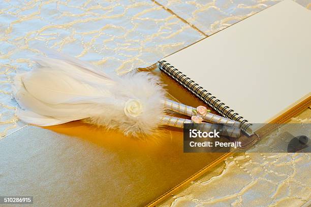 Photo Of A Wedding Register And Feather Pen Wedding Guestbook Stock Photo - Download Image Now