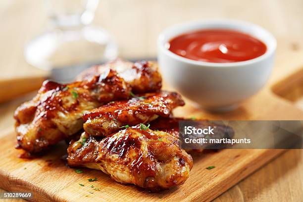 Chicken Wings With Sriracha Sauce Stock Photo - Download Image Now - Chicken Wing, Animal Wing, Barbecue - Meal