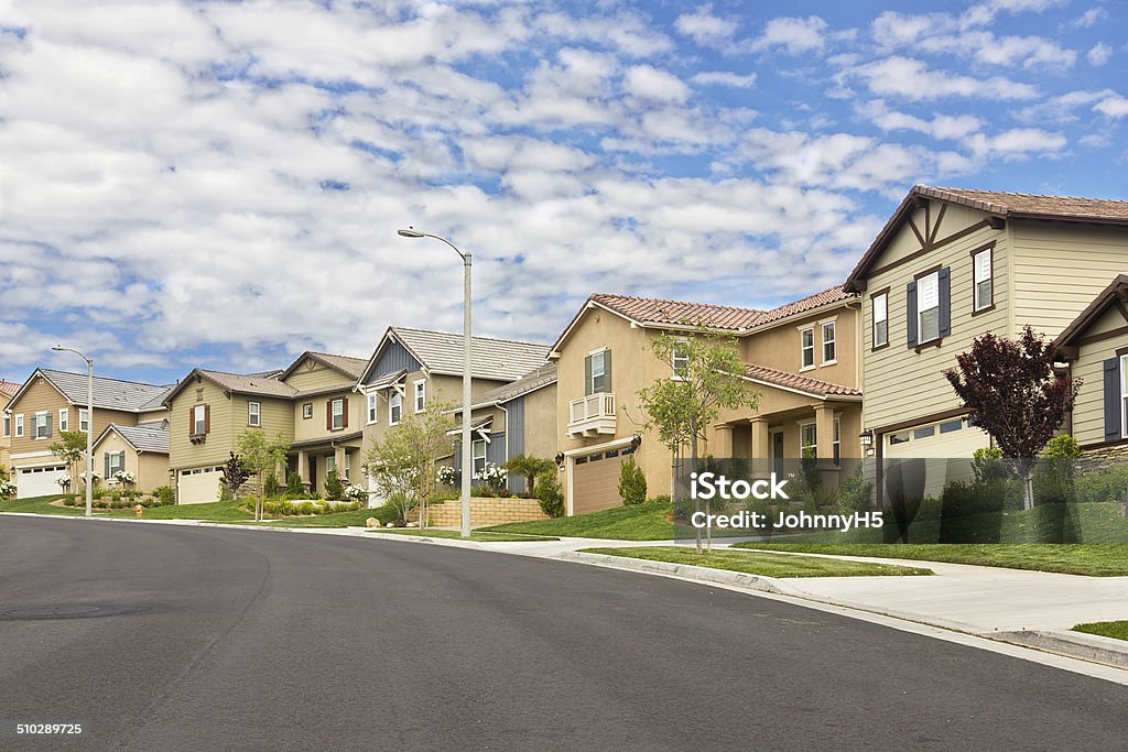 Suburb Homes Homes in the suburbs are built on a hill. House Stock Photo