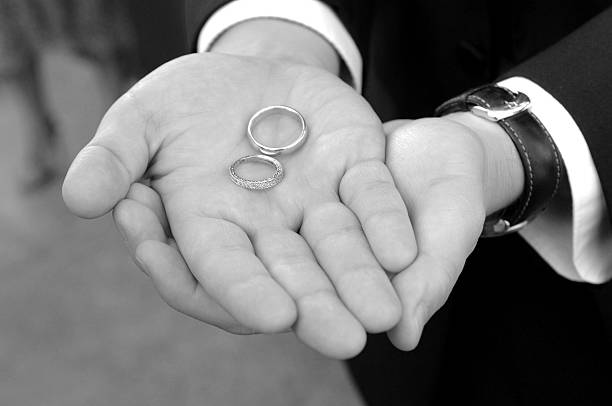 istock Man holding wedding rings 510289835