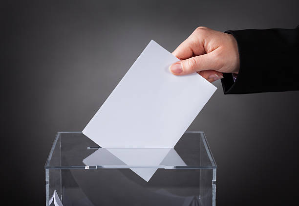 istock Hand Putting Ballot In Box 510290115