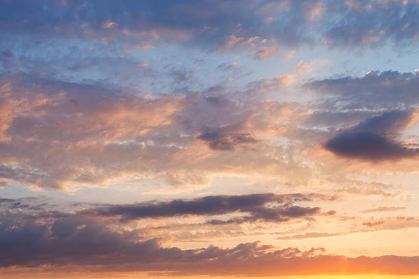 istock pink clouds in blue sky at sunset 510291713