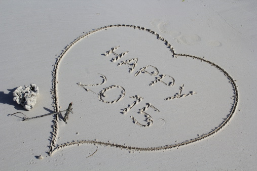 A heart drawn on the sand beach with coral at Seychelles islands for 2015