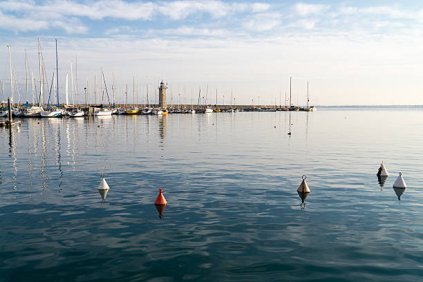 istock Desenzano lighthouse, Garda lake, Italy 510301632