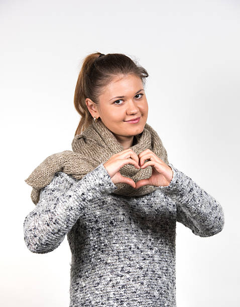 istock woman with  love sign 510301986