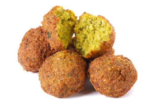 whole and half falafel isolated on a white background closeup