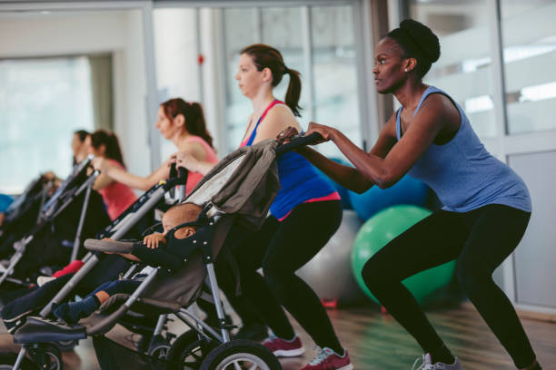 Mothers Exercise with Their Babies stock photo