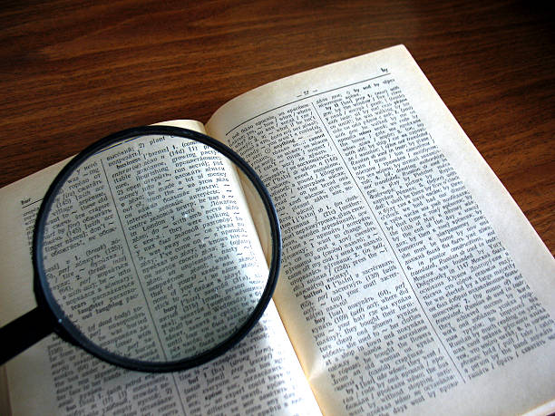 istock book and magnifying glass 510303615