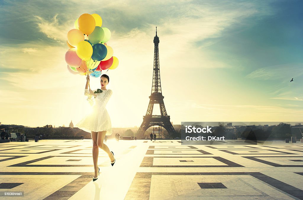 Fashion Paris young attractive woman with bright balloons. Amazing sunrise on trocadero place and eiffel tower in Paris Paris - France Stock Photo