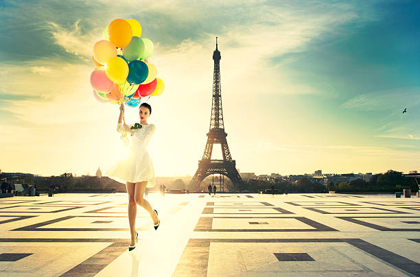 Fashion Paris young attractive woman with bright balloons. Amazing sunrise on trocadero place and eiffel tower in Paris paris fashion stock pictures, royalty-free photos & images