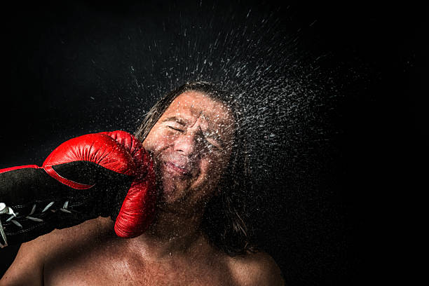 knock out Sweating fighter is punched in the face violence boxing fighting combative sport stock pictures, royalty-free photos & images