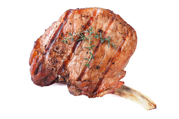 bistecca di maiale alla griglia, isolato su sfondo bianco - lamb isolated meat animal bone foto e immagini stock