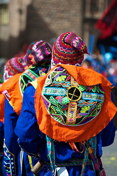 Inti Raymi Festival Male Dancers The backs of costumed young men dancing in the traditional Inti Raymi festival in Cusco, Peru.  Inti Raymi is the annual festival celebrating Incan culture in Peru, and involves traditional dress and dances in the central Plaza de Armas of Cusco. inti raymi stock pictures, royalty-free photos & images