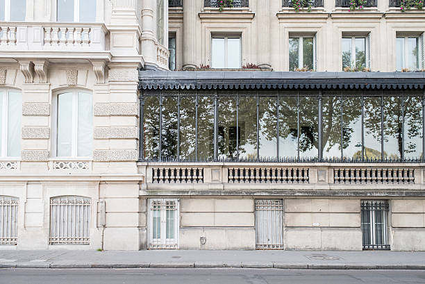 Parisian apartments with trees reflected stock photo