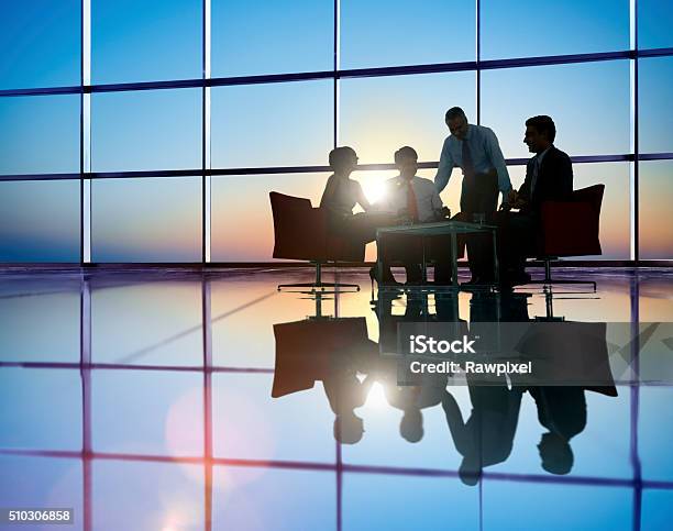 Group Of Business People Meeting In Back Lit Concept Stock Photo - Download Image Now