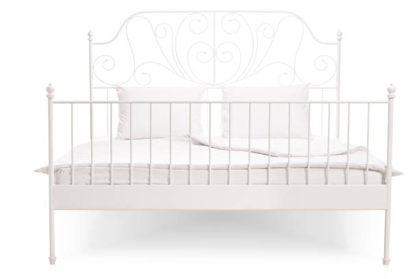 istock White bed with a vintage decoration 510307644