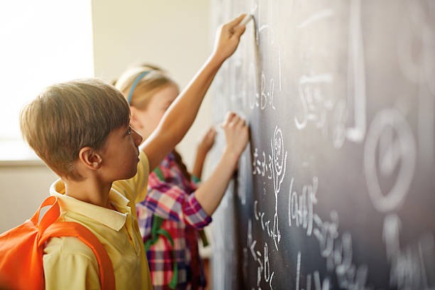 istock Children by blackboard 510308174