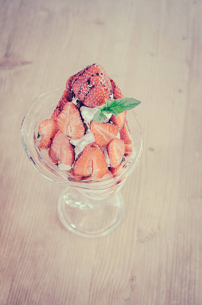 Strawberry slices with ice cream in the cup - Retro look