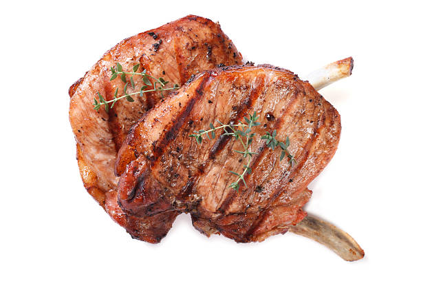 istock two grilled pork steak isolated on white background 510308671