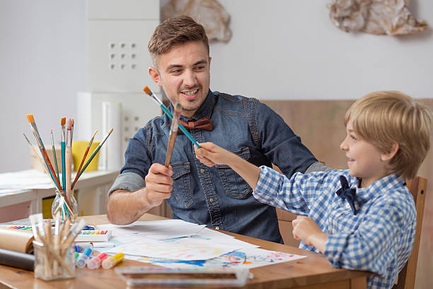 istock Boy with father playing together 510309602