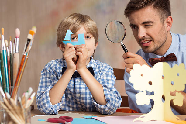 istock Little boy playing with father 510309730