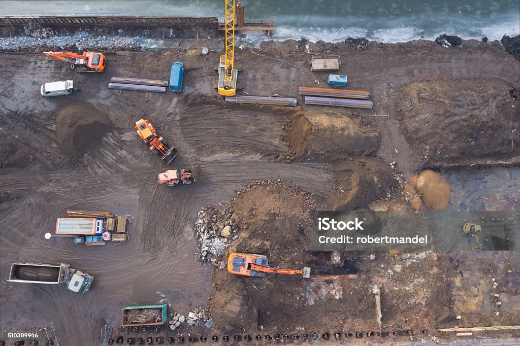 Construction Excavators working at construction site, top view Construction Site Stock Photo
