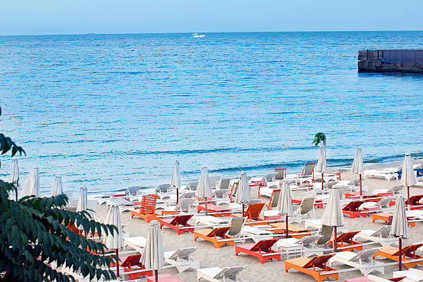 istock Seaside view with orange and white sunbeds 510311620