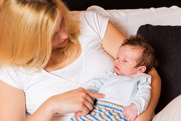 istock Young mother and newborn resting on her chest 510312360