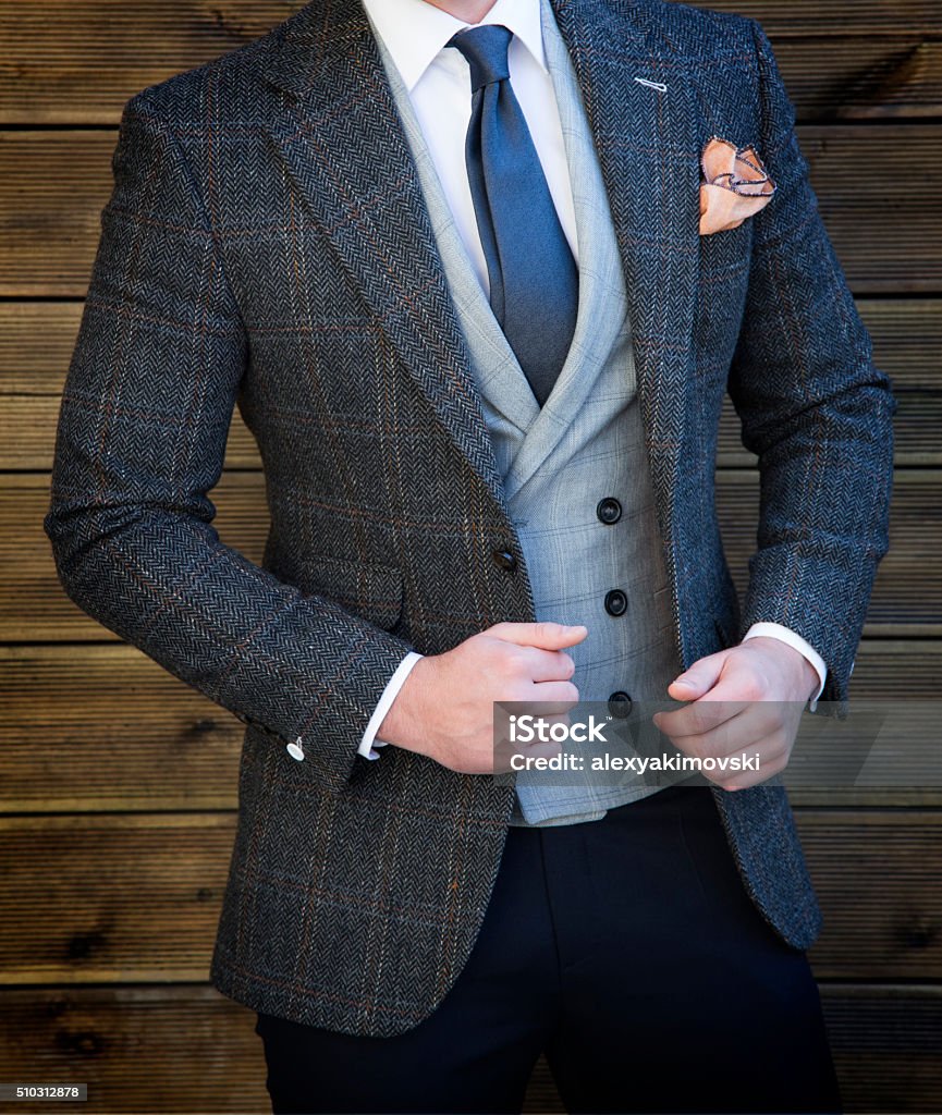 Suited man posing Man in suit posing Men Stock Photo