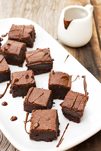 istock Sliced brownies on white plate. 510313760