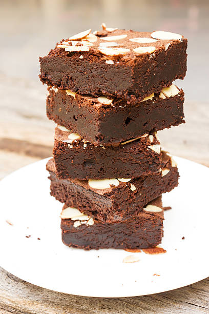 istock Sliced brownies on white plate. 510313898