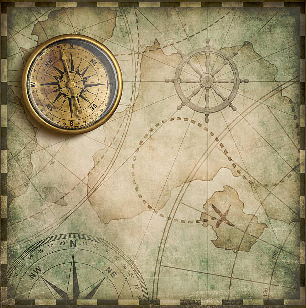 istock aged brass antique nautical compass and old treasure map 510318116