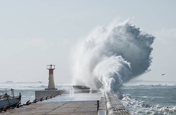 istock Huge swell crashes into Kalk Bay harbour wall 510320378