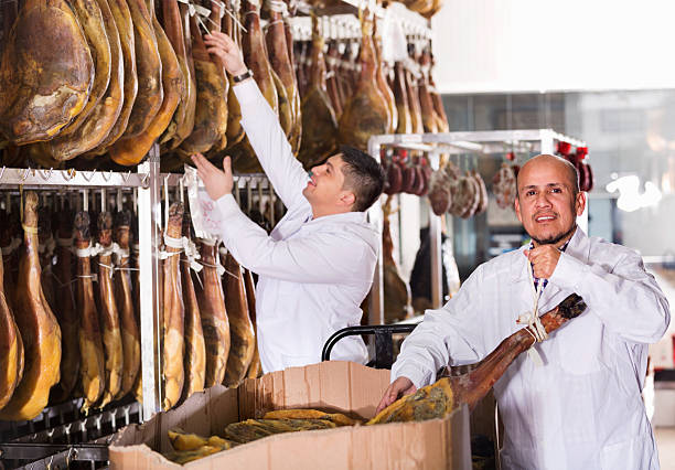 istock Ordinary Butchery technologists checking joints of iberico jamon 510323080