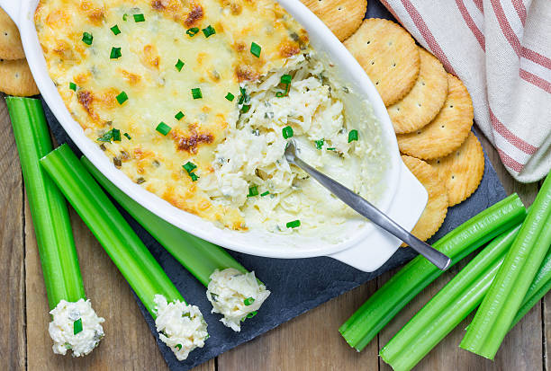 istock Baked crab dip, served with celery sticks and crackers 510325124