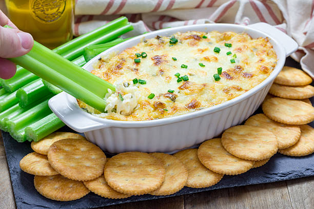 istock Baked crab dip, served with celery sticks and crackers 510325200