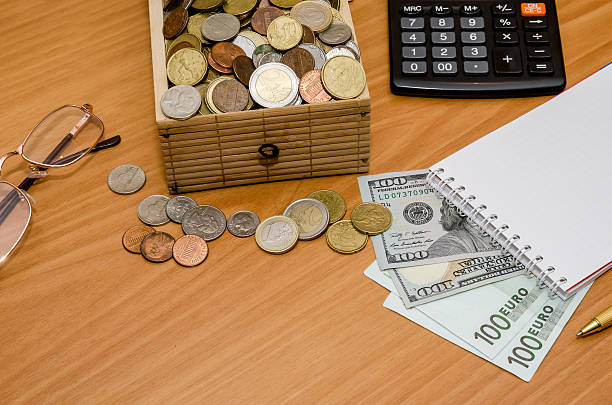 istock open treasure chest with coin. Us dollar and euro, notepad 510326782