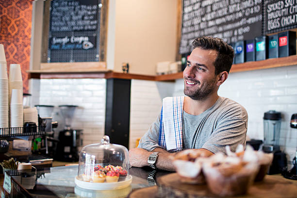 istock Smiling barista at coffee shop counter 510330314